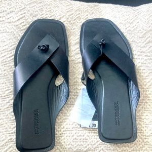 Beautiful black flip flops.